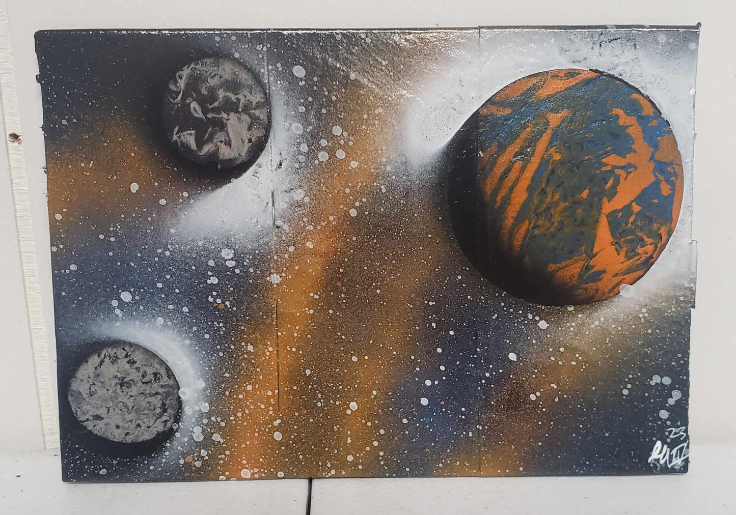 Orange and Blue Planet with Moons